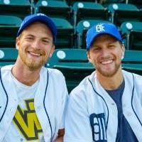 Photo of two young men wearing Tigers and GVSU gear